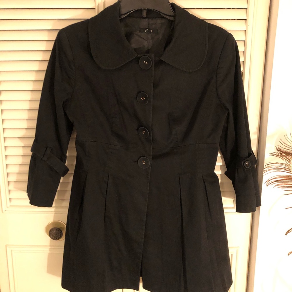 Adorable light-weight black jacket. Flared 3/4 sleeve cuffs and flares at waist.